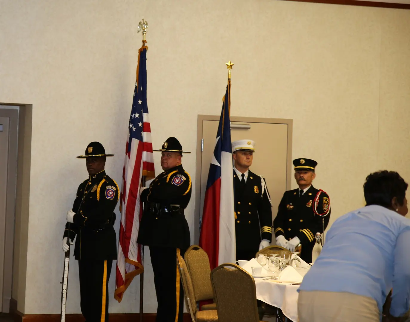A group of police officers standing in a room.