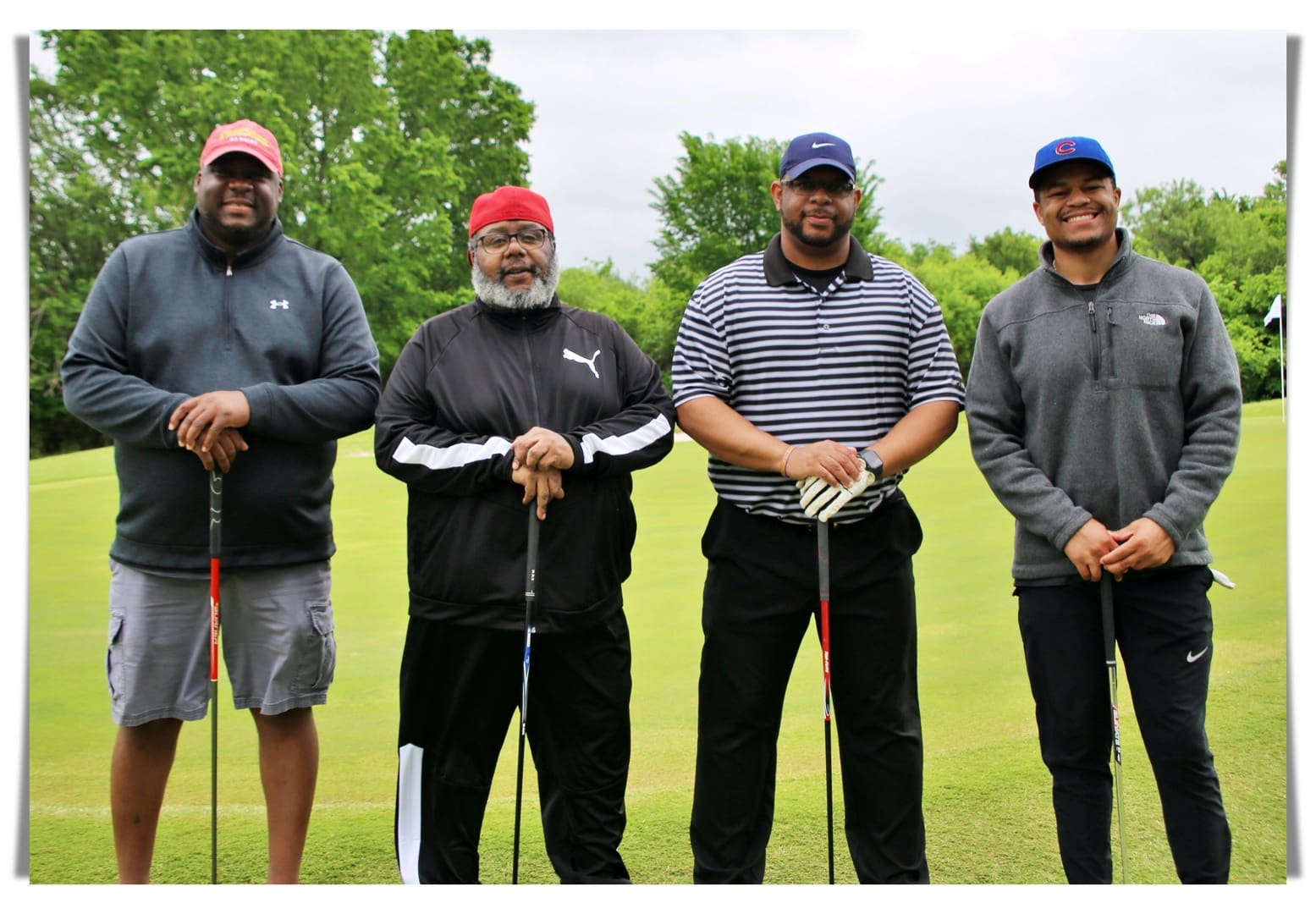 group photo of golfers wearing hats 2