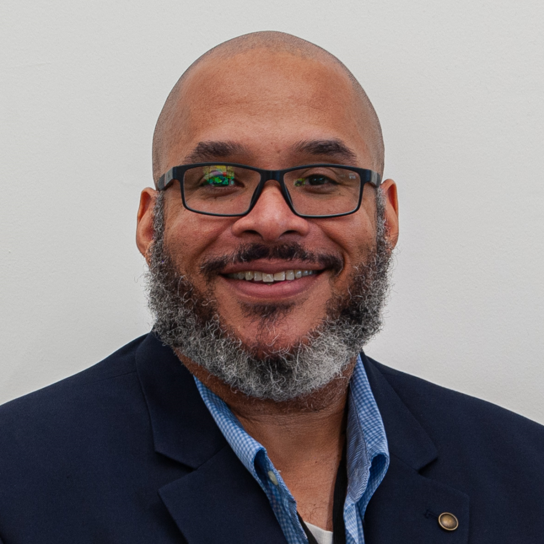 Smiling man with glasses and beard